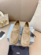 Beige suede loafer mules with buckle strap and chunky lug sole, Prada