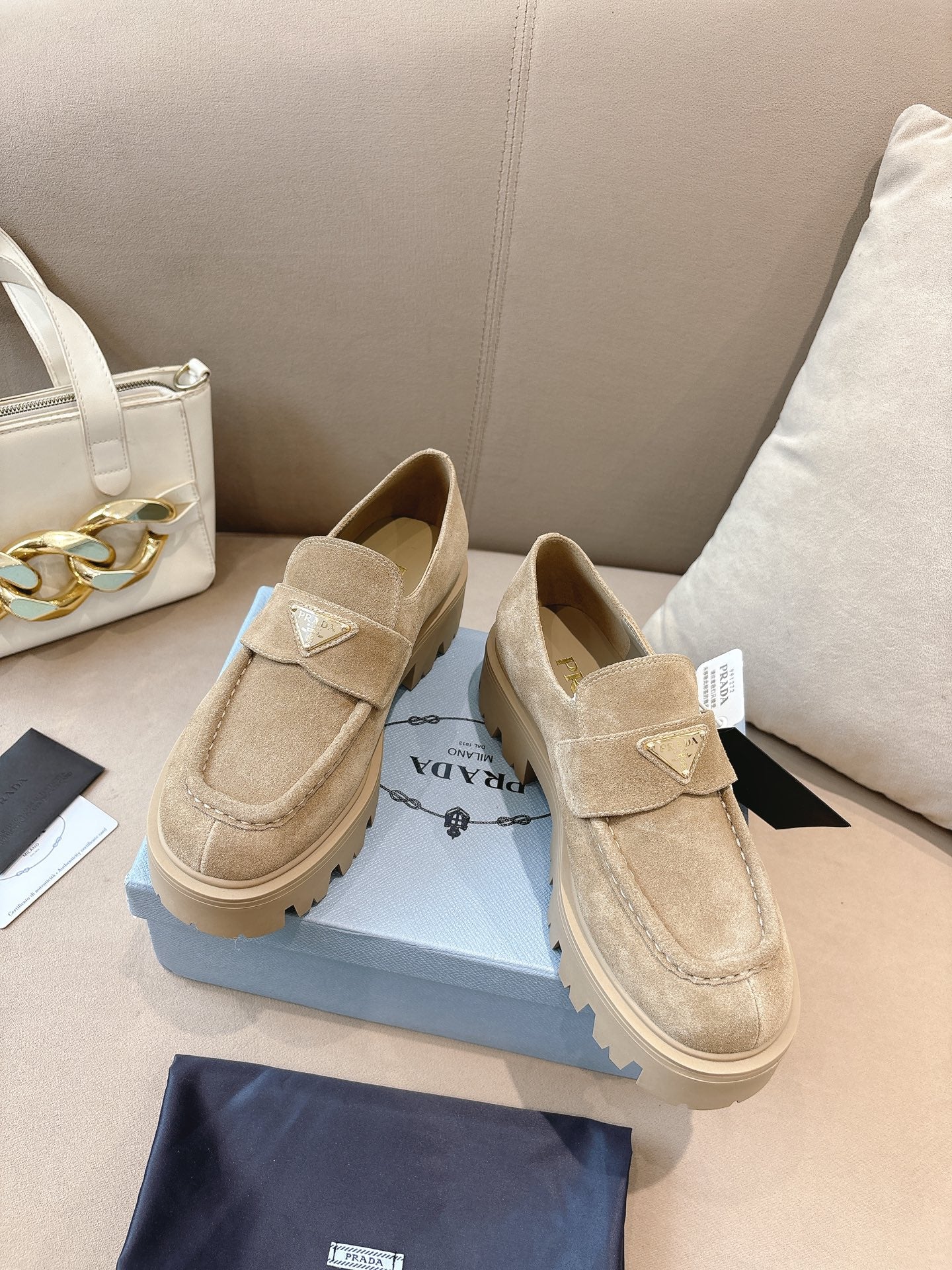 Beige suede loafers with strap detail and chunky sole, Prada