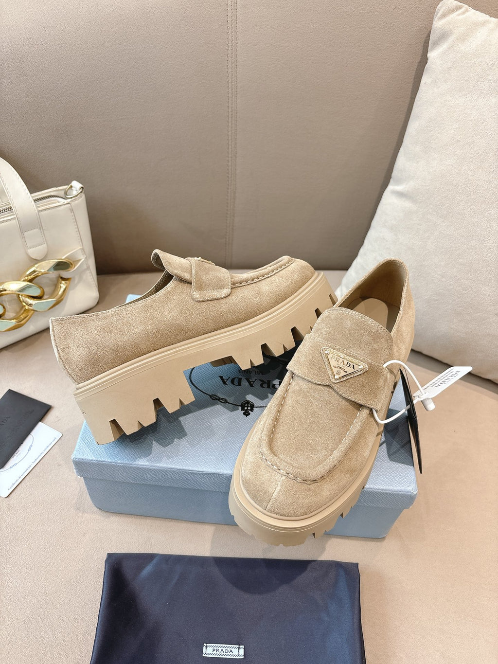 Beige suede loafer mules with strap and chunky lug sole, Prada side view