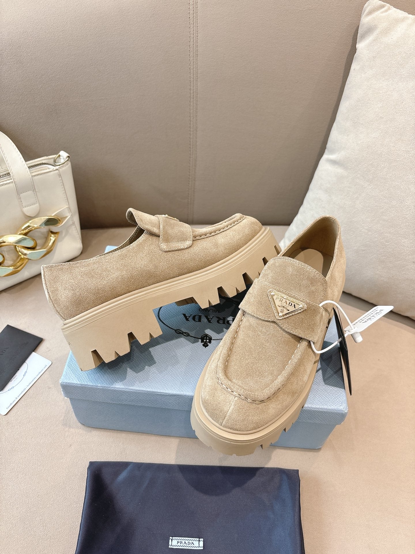 Beige suede loafer mules with strap and chunky lug sole, Prada side view