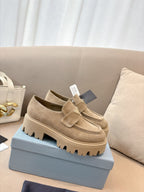 Beige suede loafer mules with buckle strap and thick tread sole, Prada