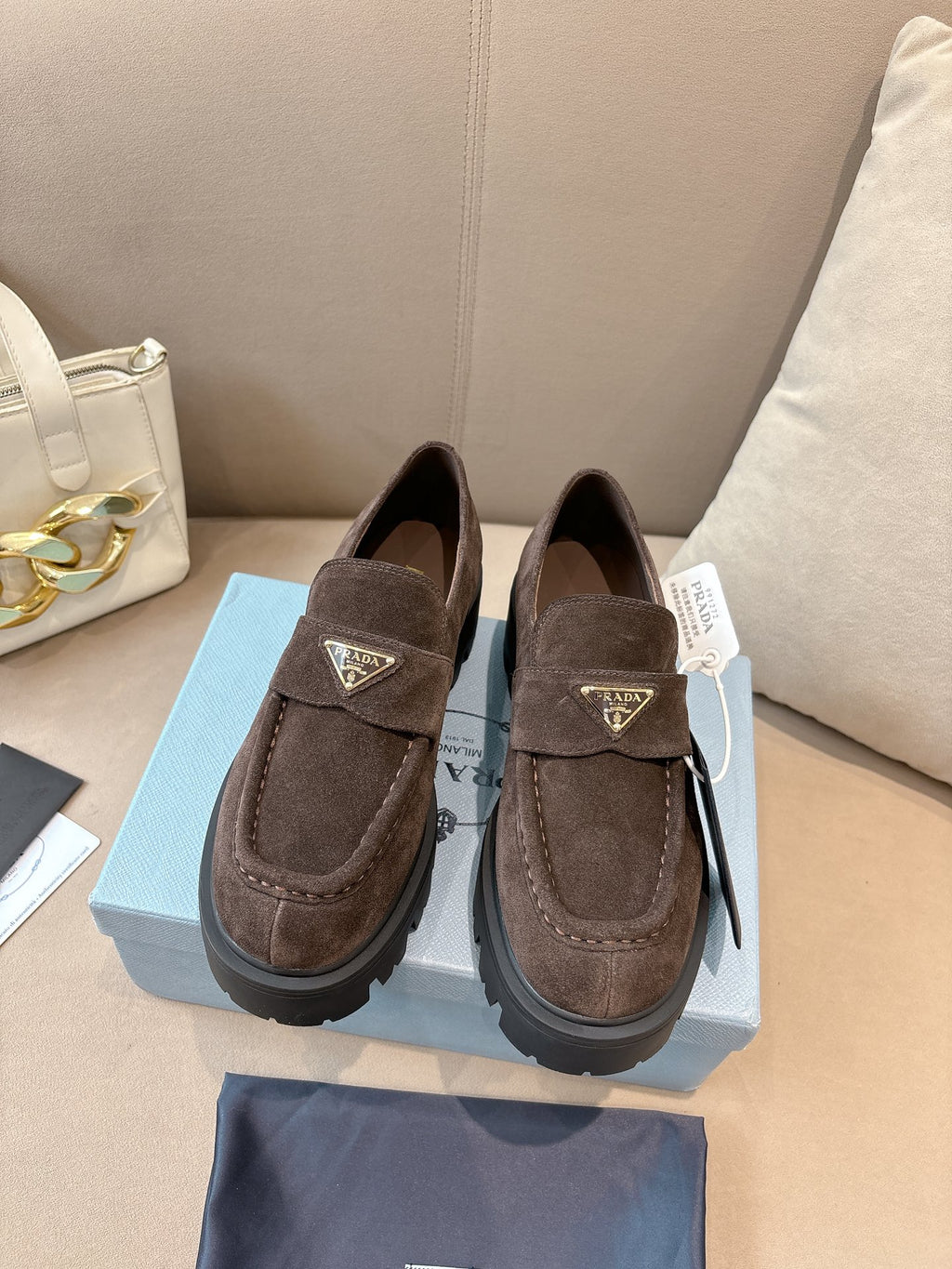 Prada ladies suede loafers, dark brown slip-on with logo plaque and lug sole