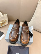 Prada ladies brown leather loafers with buckle strap, logo plaque, chunky lug sole