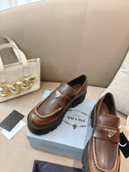 Prada ladies brown leather loafers with buckle strap and logo plaque, chunky platform sole