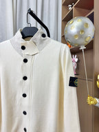Stone Island knit cardigan, cream sweater with stand collar and black buttons close-up