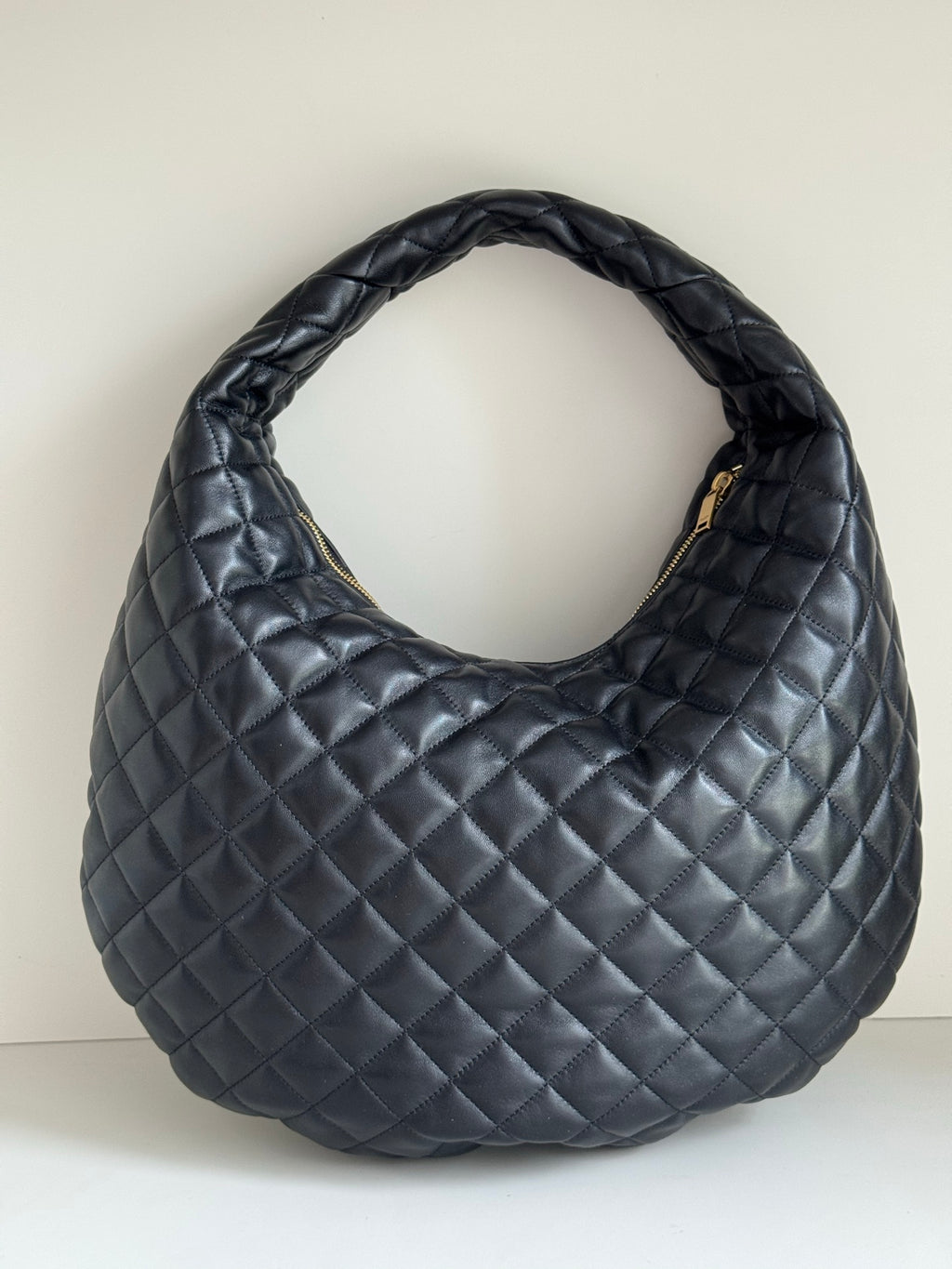 YSL quilted hobo bag with diamond stitching, dark leather-look, curved handle