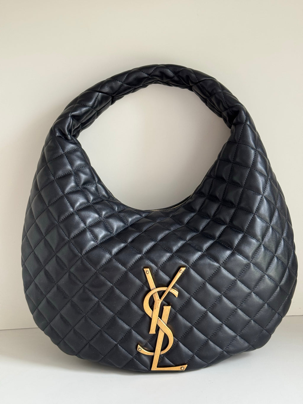 YSL quilted hobo bag, dark leather-look, gold YSL logo and braided handle