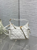 White quilted Dior shoulder bag with top handle and gold hardware, short strap.