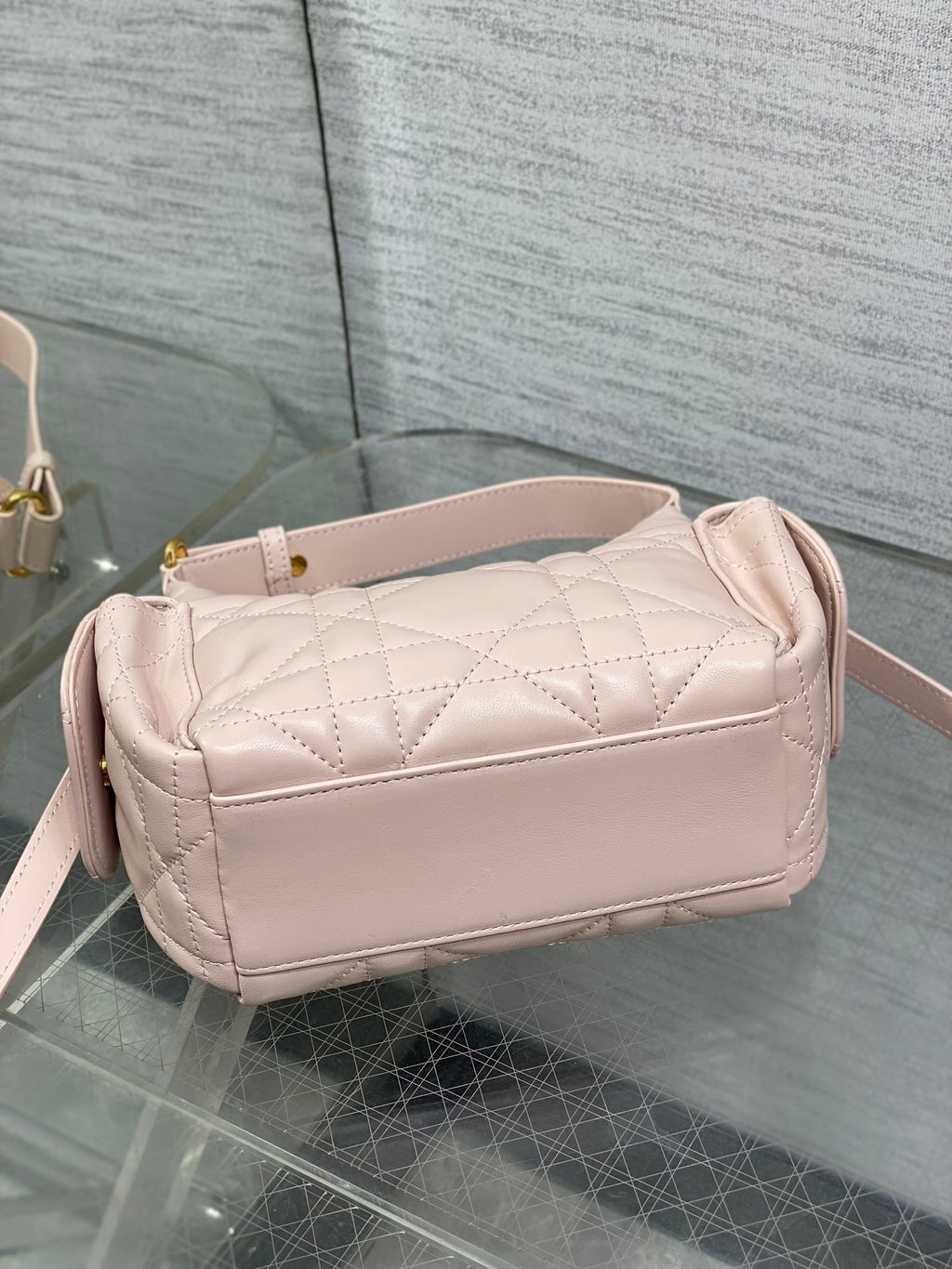 Dior quilted light pink shoulder bag with curved top and side strap attachment points