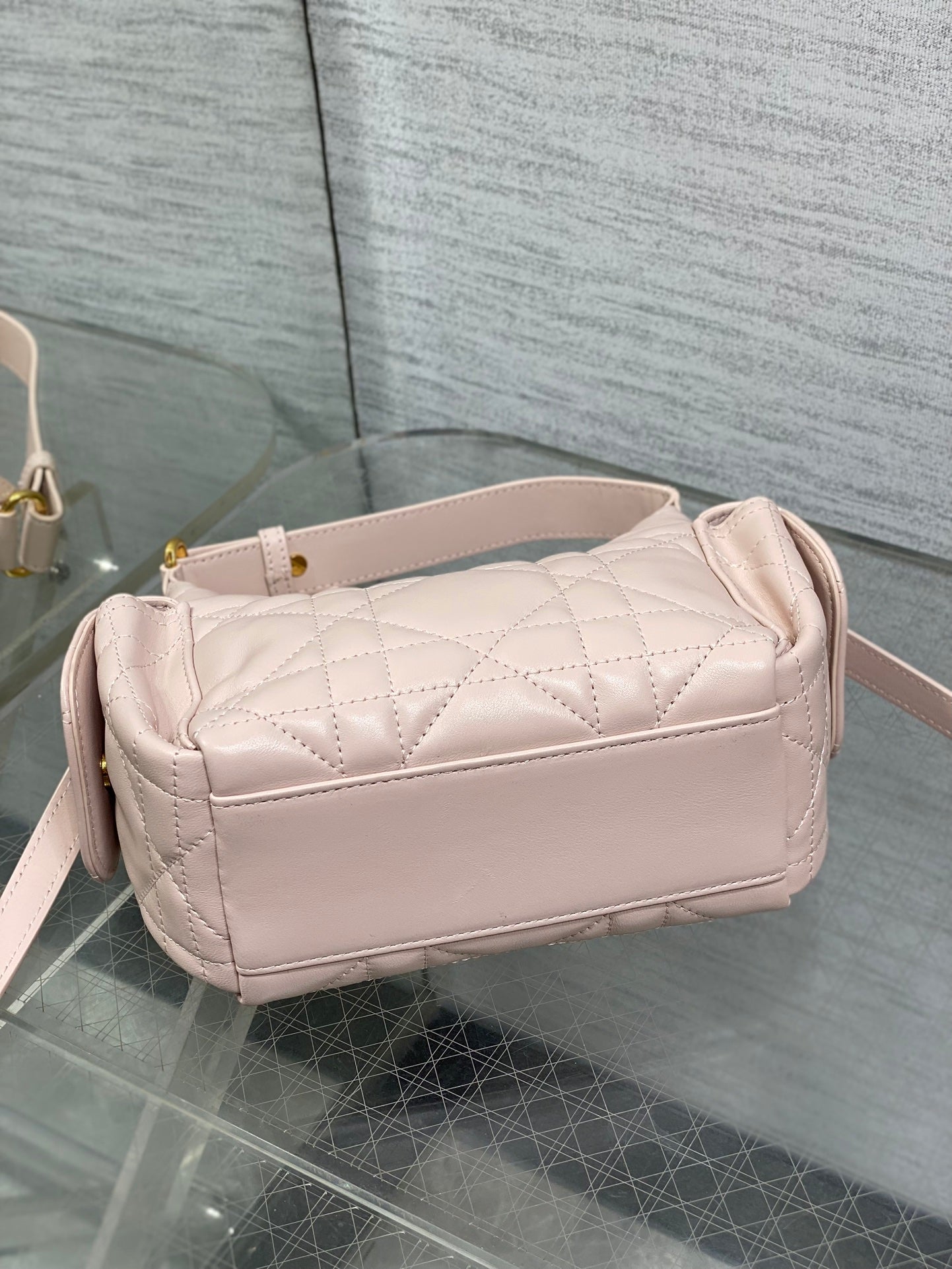 Dior quilted light pink shoulder bag with curved top and side strap attachment points