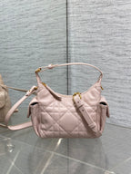 Dior quilted light pink hobo bag with top handle, crossbody strap, and gold hardware
