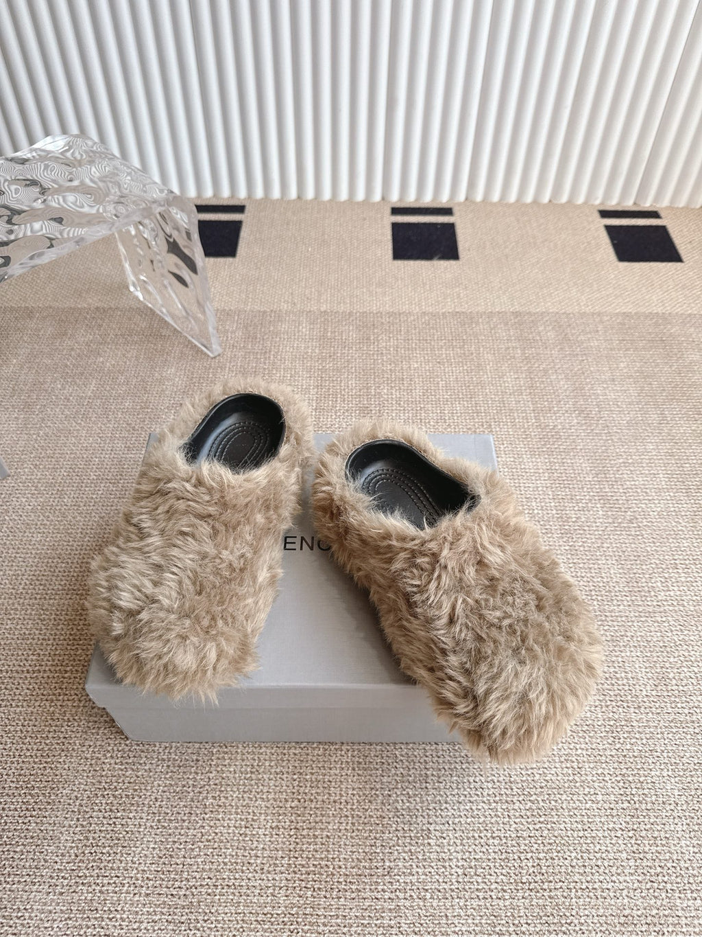 Balenciaga furry beige slide sandals with black footbed, shown on the box