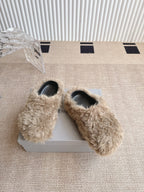 Balenciaga furry beige slide sandals with black footbed, shown on the box