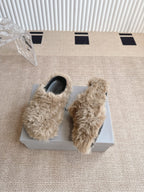 Balenciaga beige faux-fur slide sandals with black interiors, on their box