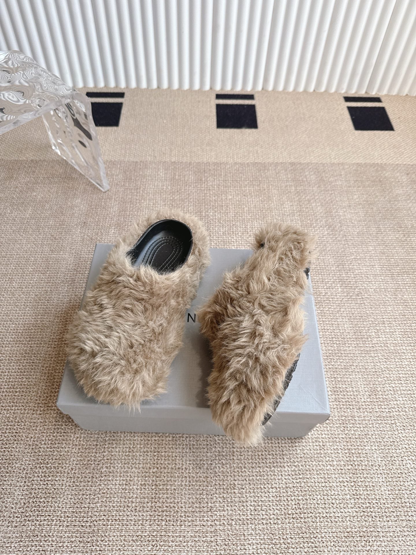 Balenciaga beige faux-fur slide sandals with black interiors, on their box
