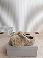Balenciaga fuzzy beige slide sandals, open toe view on a shoe box