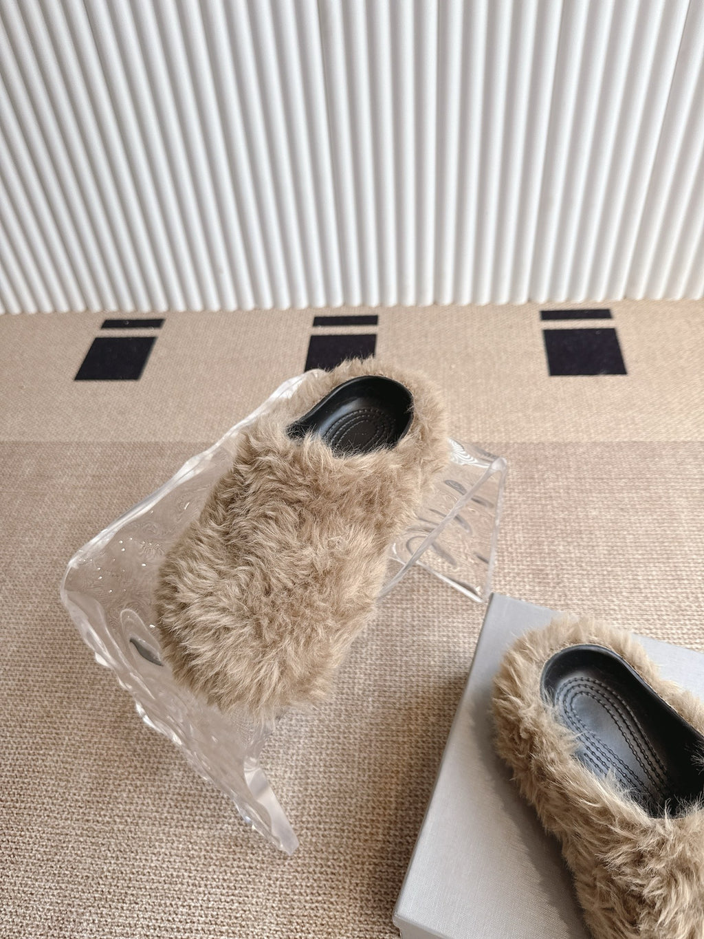Balenciaga beige furry slide sandals with black toe openings, wrapped in plastic