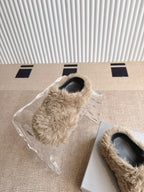 Balenciaga beige furry slide sandals with black toe openings, wrapped in plastic