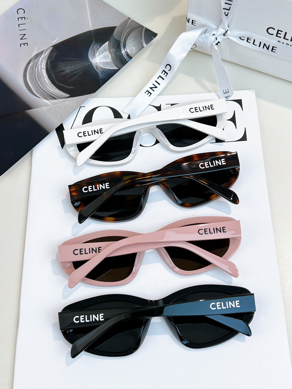 Assorted sunglasses in white, tortoiseshell, pink and black