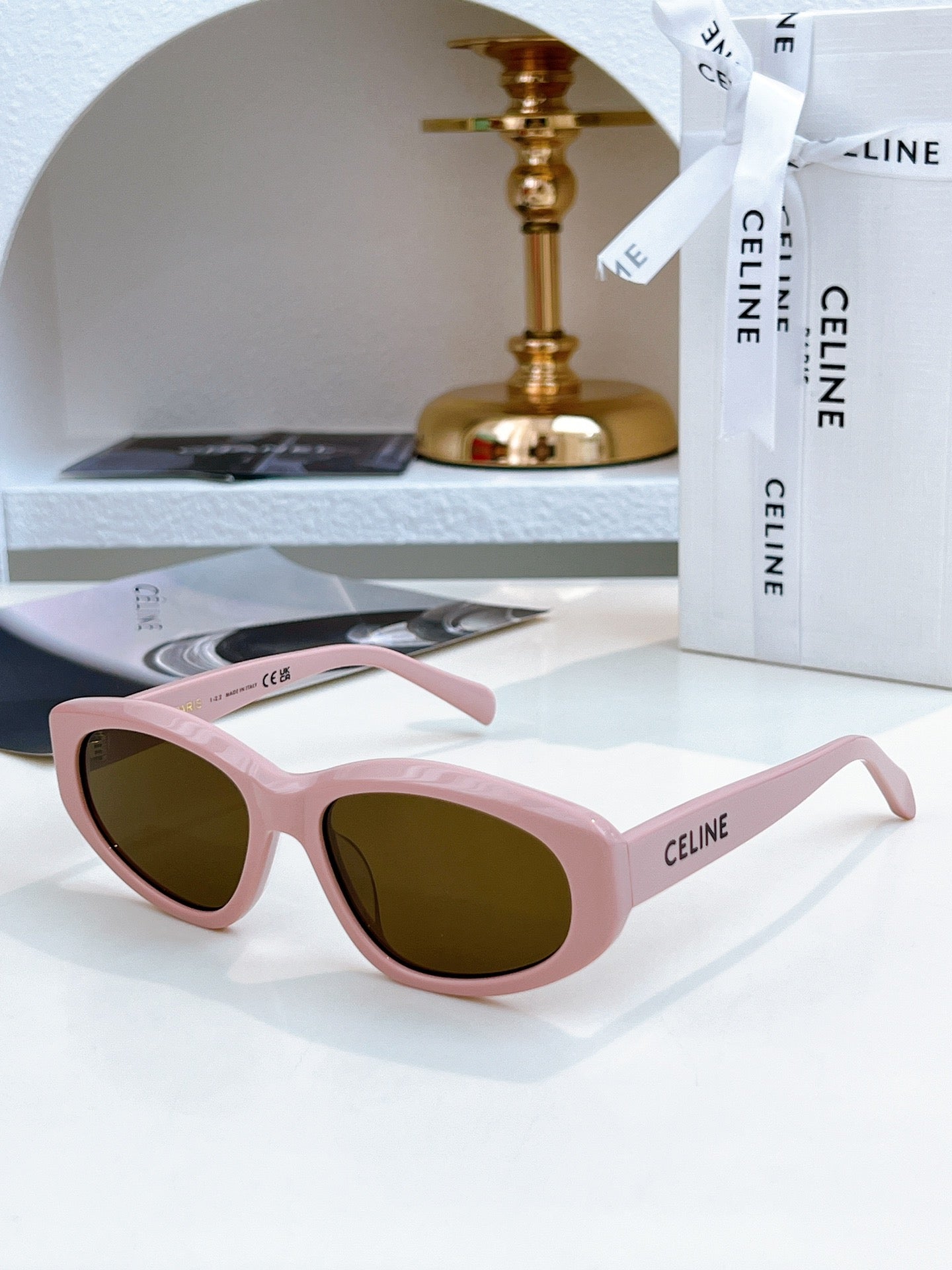 Pink Celine cat-eye sunglasses with dark brown tinted lenses