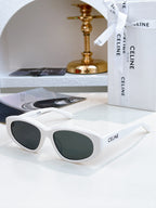 White Celine cat-eye sunglasses with dark green tinted lenses