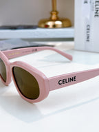 Pink Celine sunglasses with dark brown tinted lenses and logo on temple