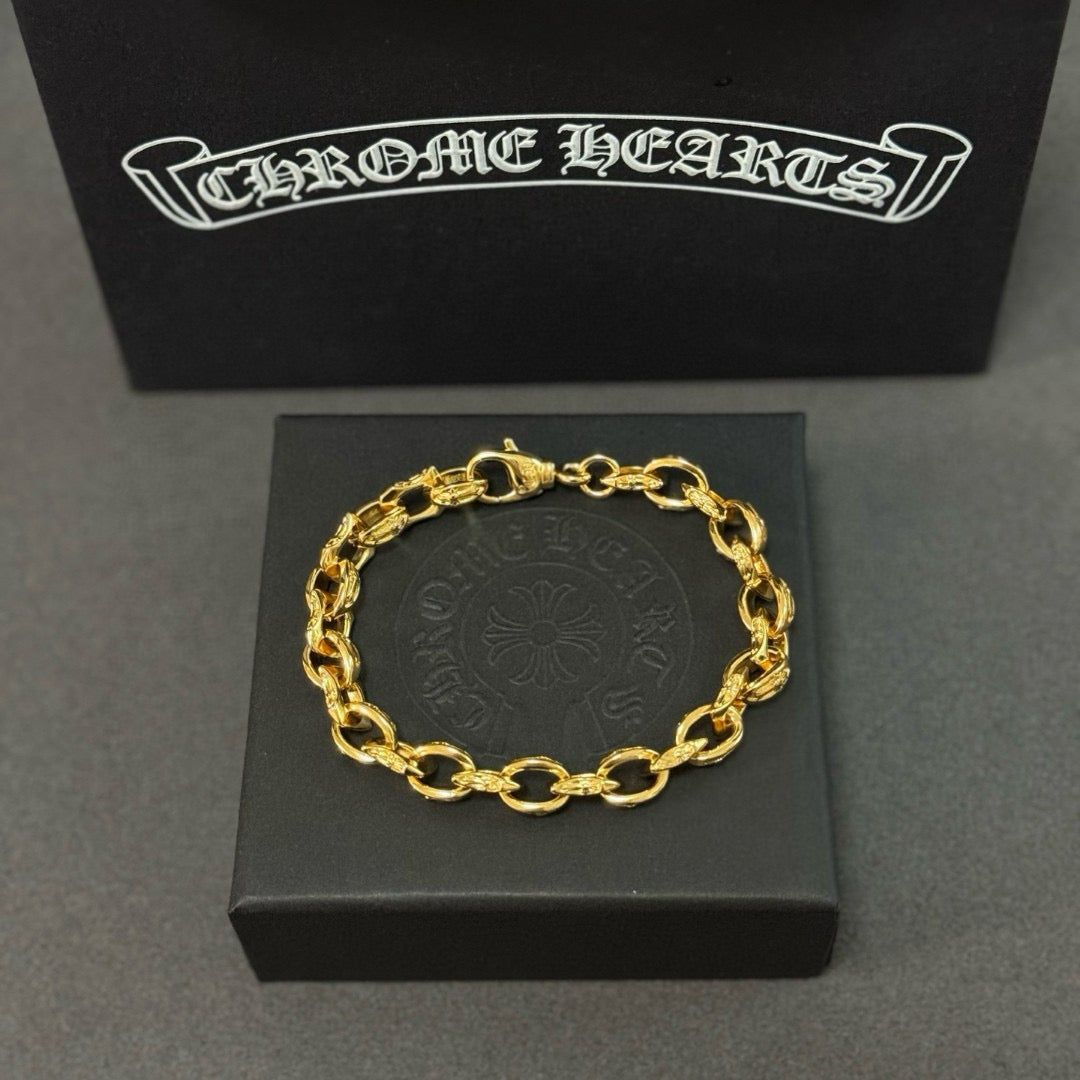 Gold chain bracelet centered on a gray jewelry box insert