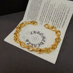 Gold chain bracelet on an inserted card with printed logo