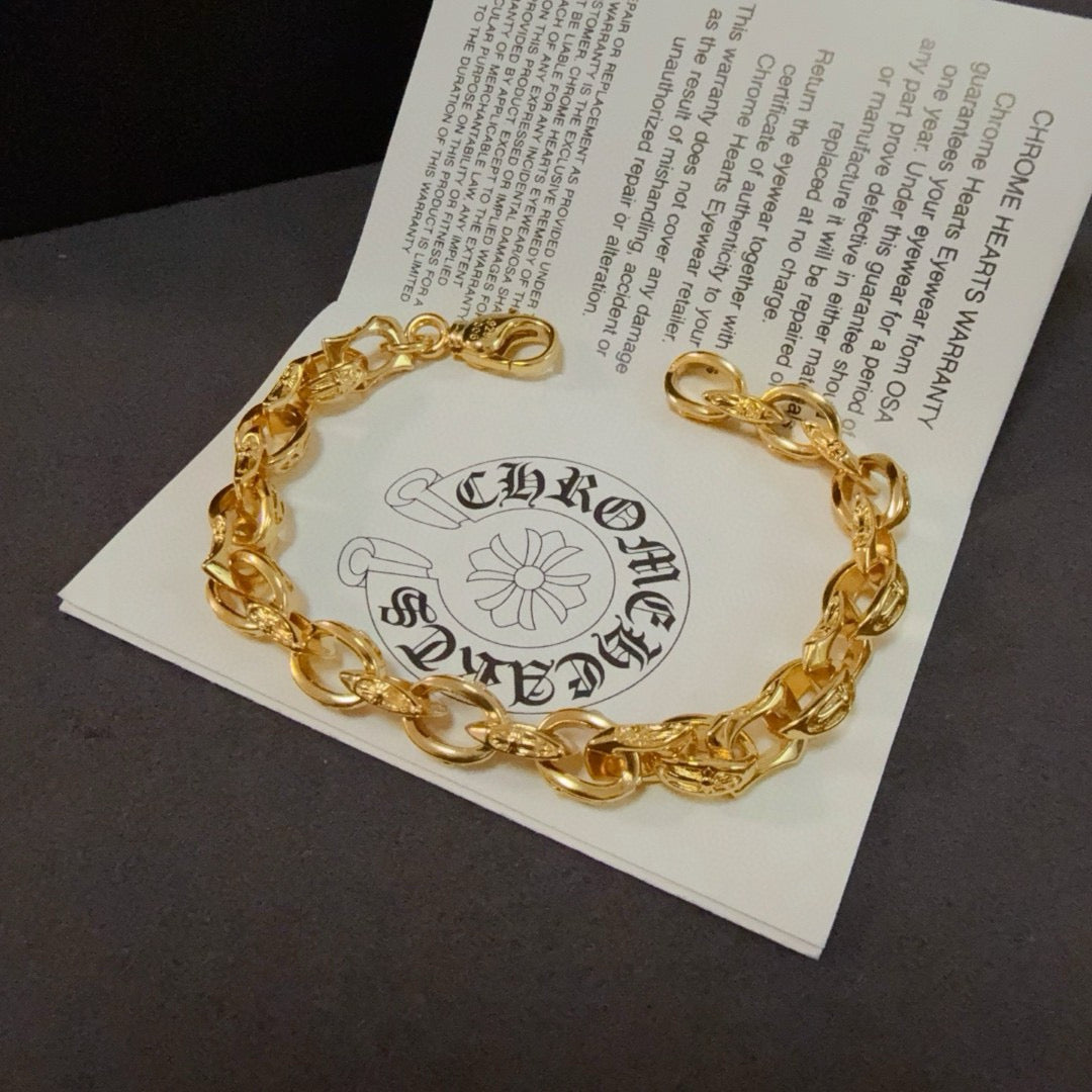 Gold chain bracelet on an inserted card with printed logo