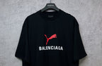 Black short-sleeve T-shirt with red puma logo and BALENCIAGA print on chest