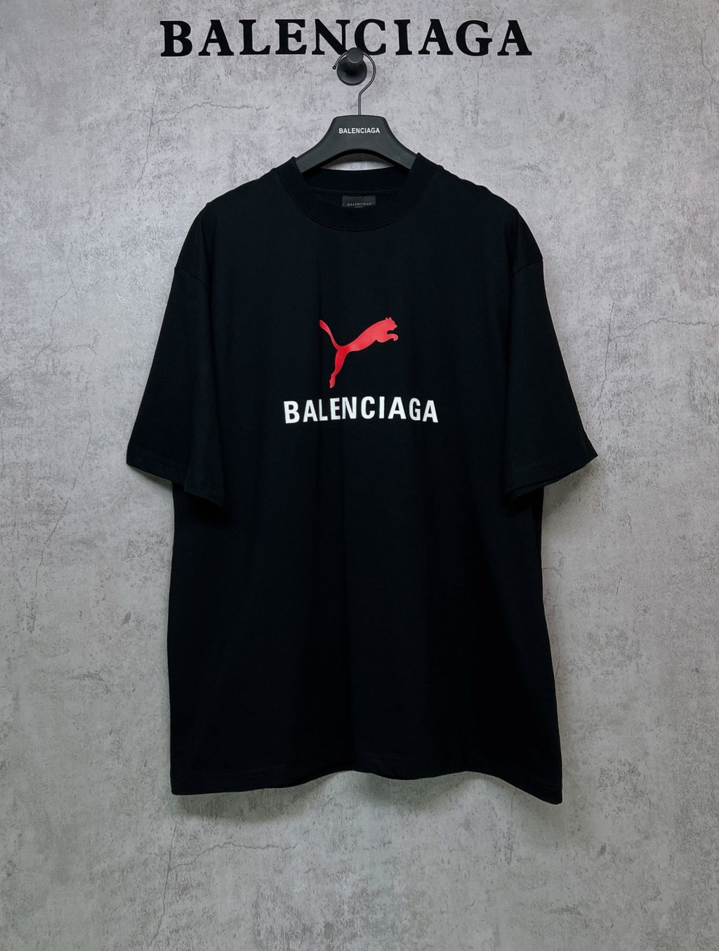 Black short-sleeve T-shirt with red puma logo and BALENCIAGA chest print