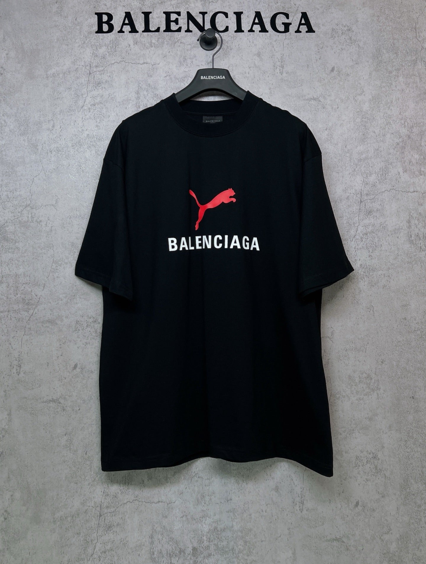 Black short-sleeve T-shirt with red puma logo and BALENCIAGA chest print