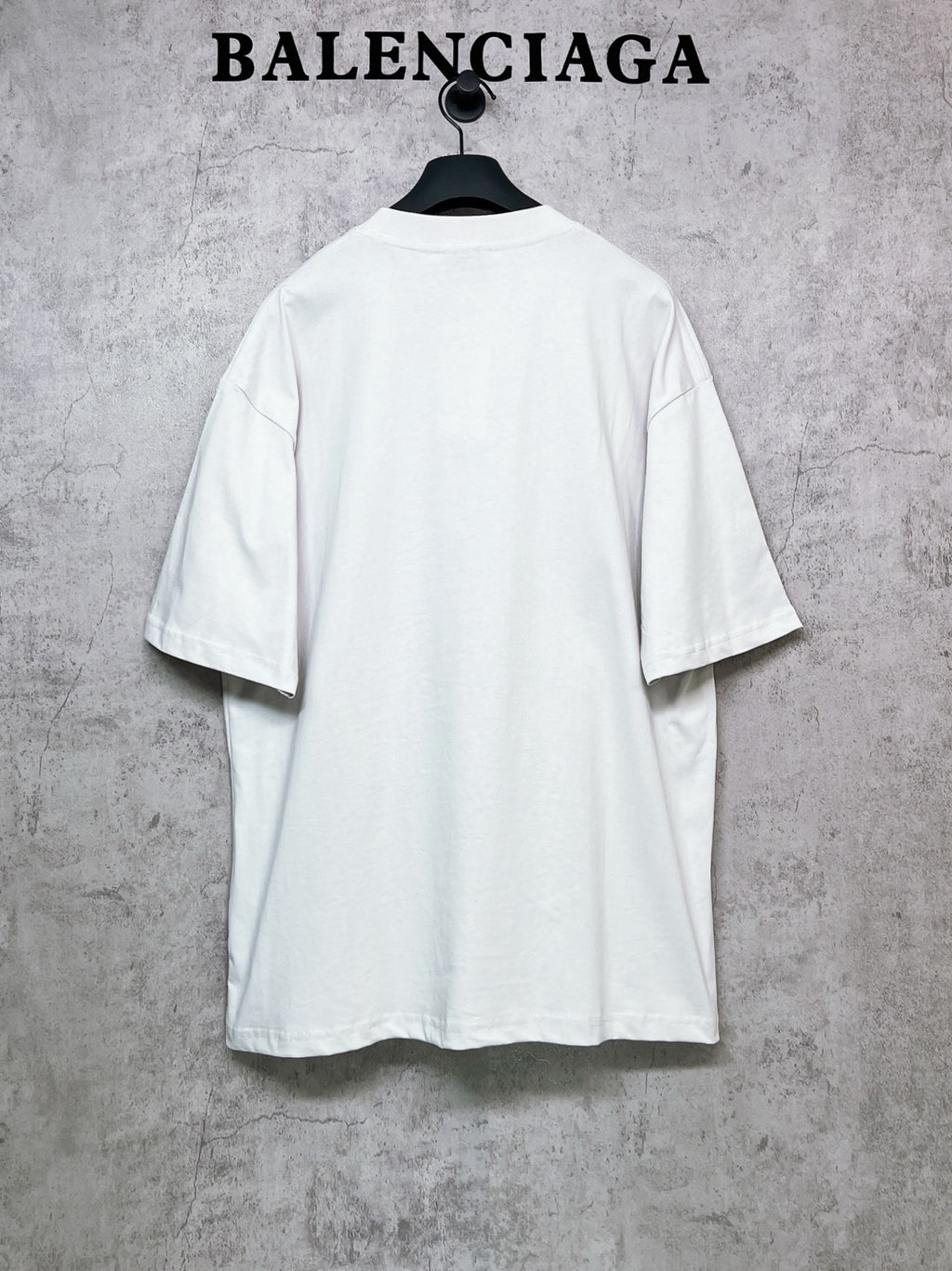 White short-sleeve T-shirt back view on hanger