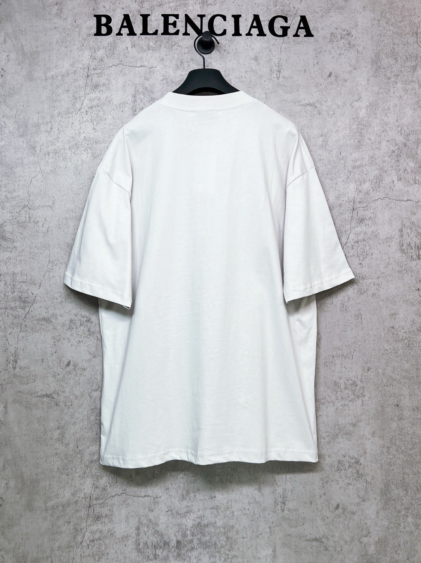 White short-sleeve T-shirt back view on hanger