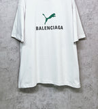 White T-shirt with green emblem and BALENCIAGA lettering on front