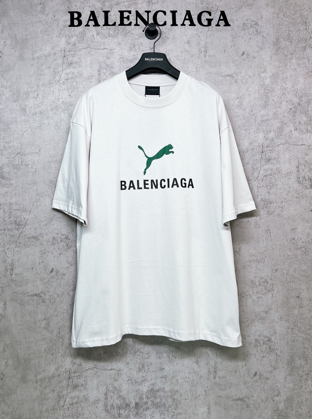 White short-sleeve T-shirt with green emblem and BALENCIAGA front print