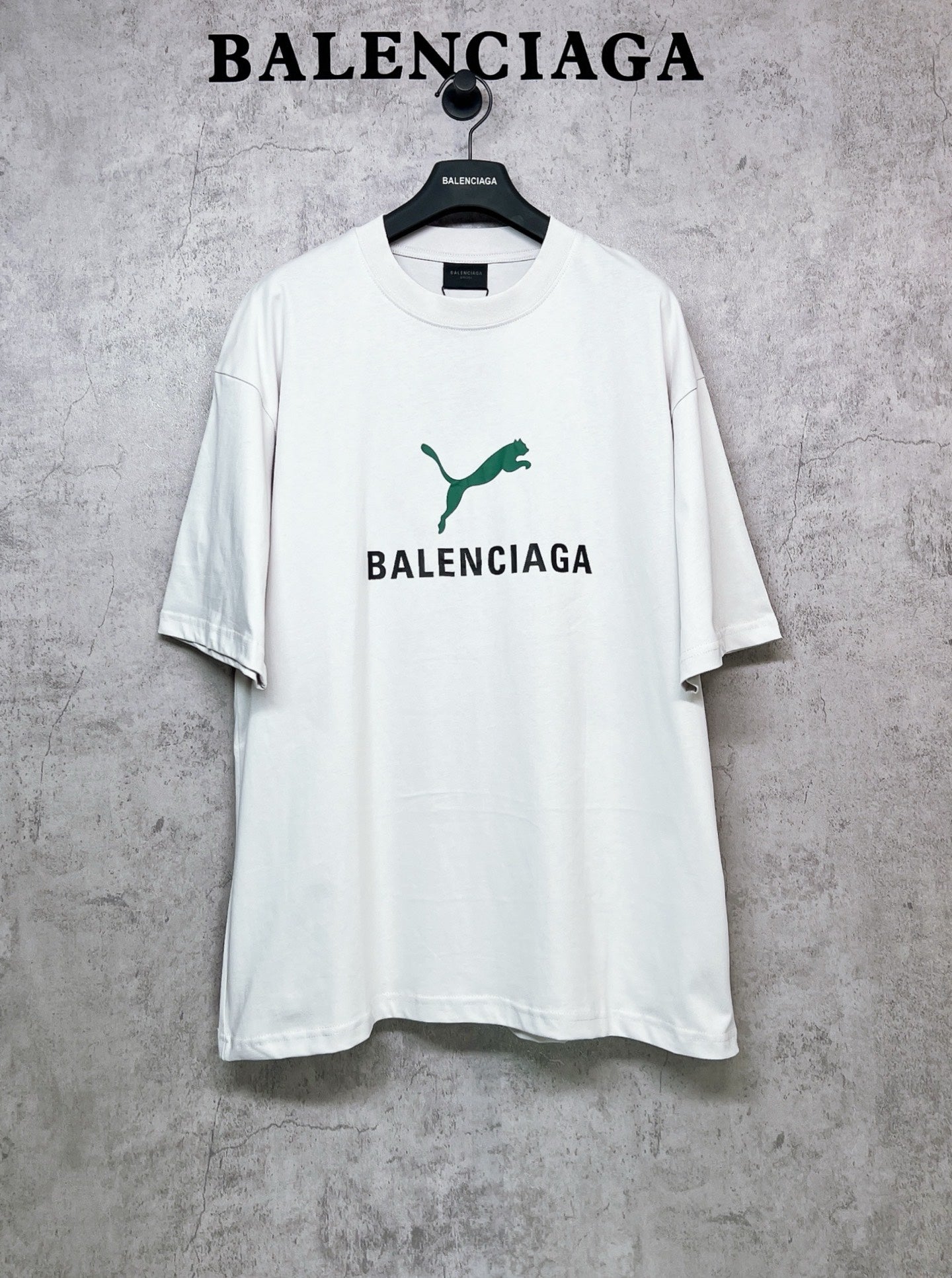 White short-sleeve T-shirt with green emblem and BALENCIAGA front print