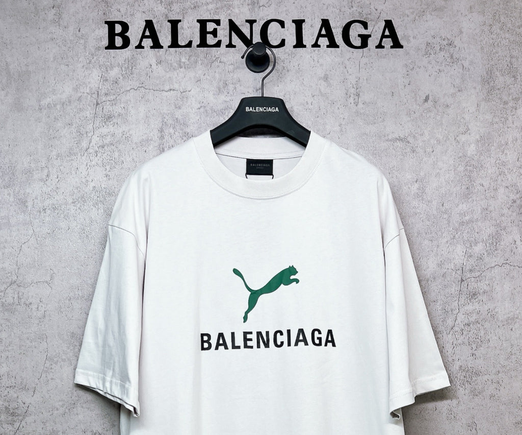 White T-shirt with green emblem and BALENCIAGA chest graphic