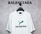 White T-shirt with green emblem and BALENCIAGA chest graphic