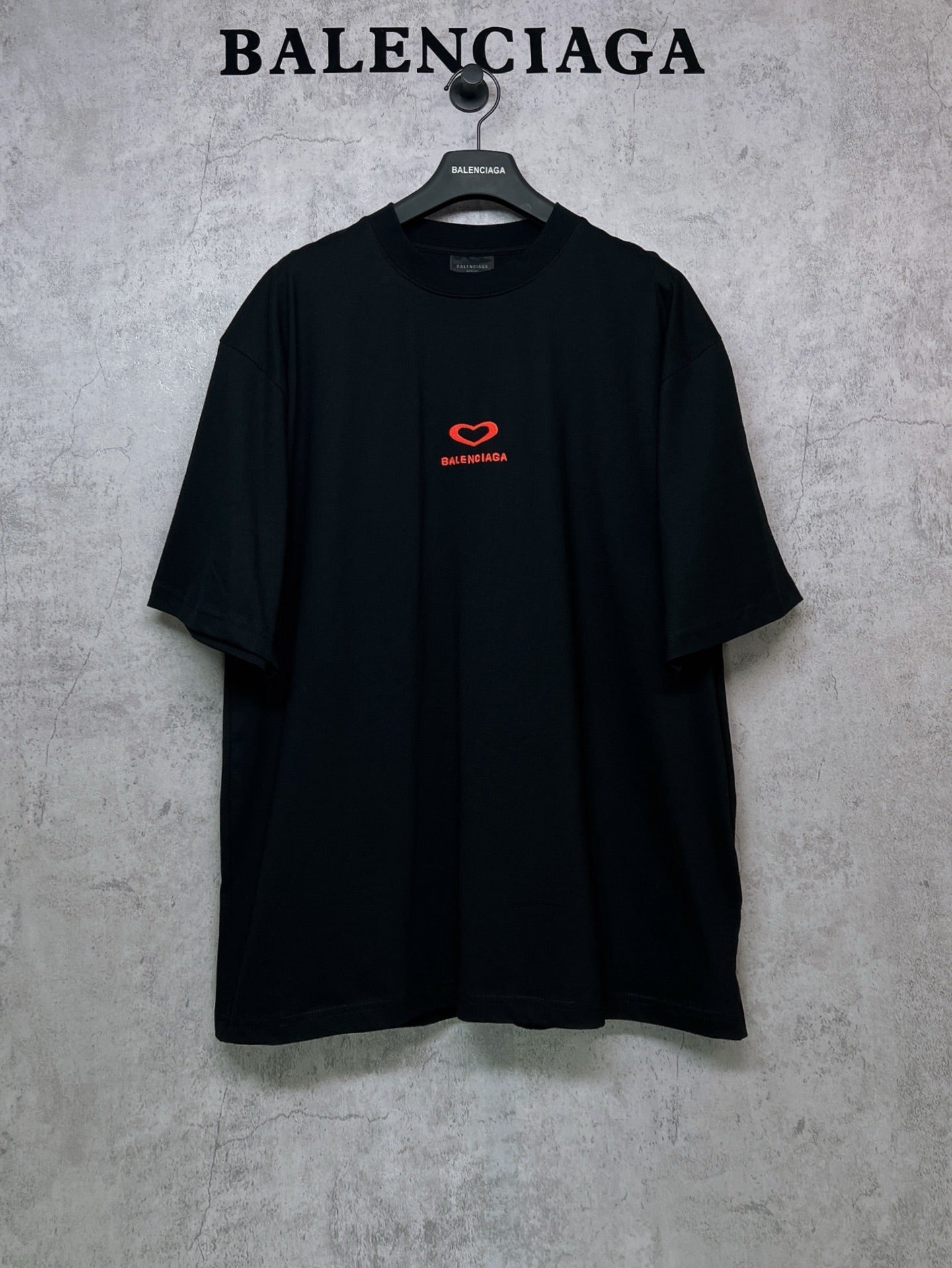 Black Balenciaga T-shirt with small red heart logo on chest