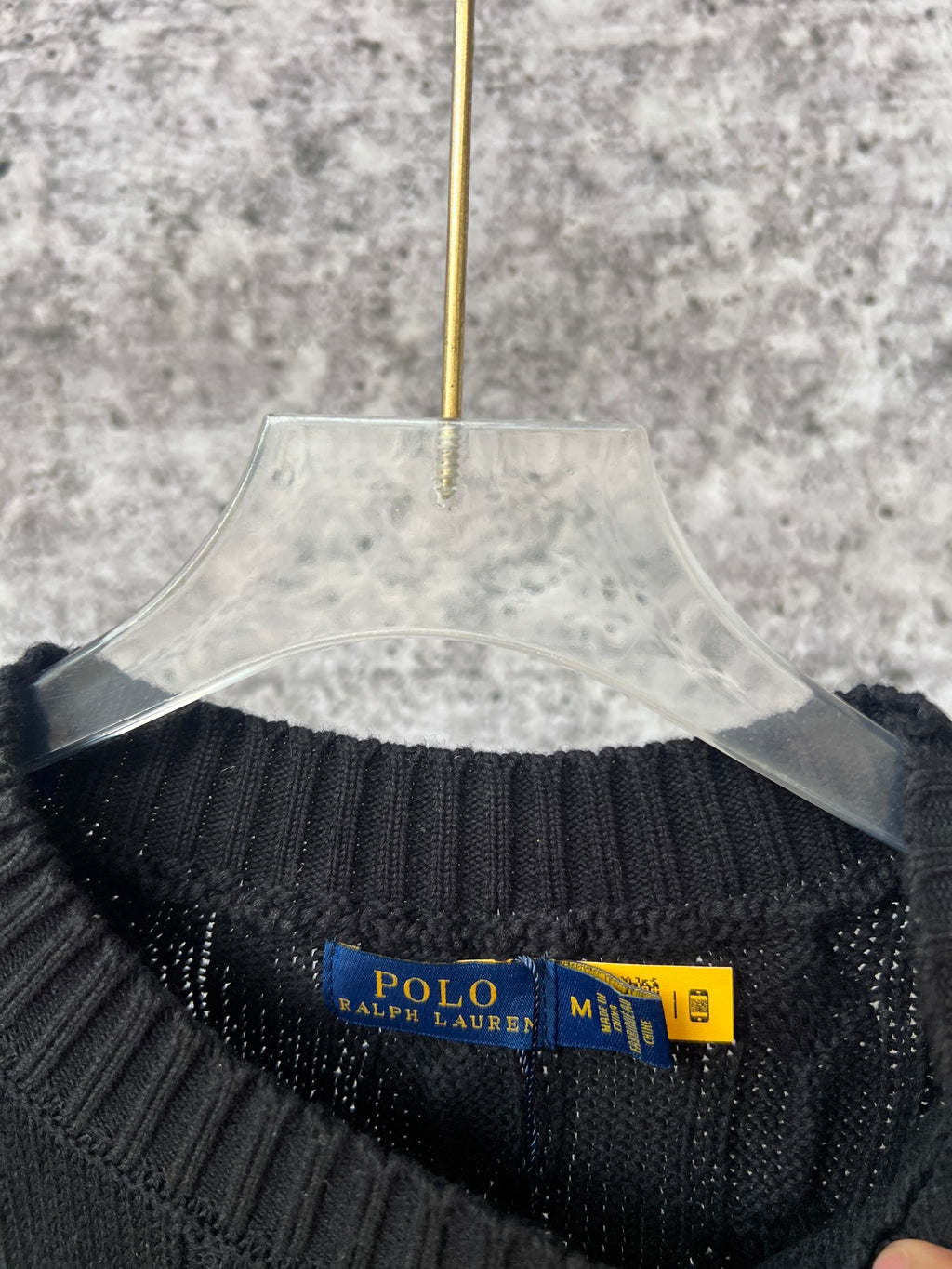 Ralph Lauren cable-knit sweater collar detail with Polo Ralph Lauren tag