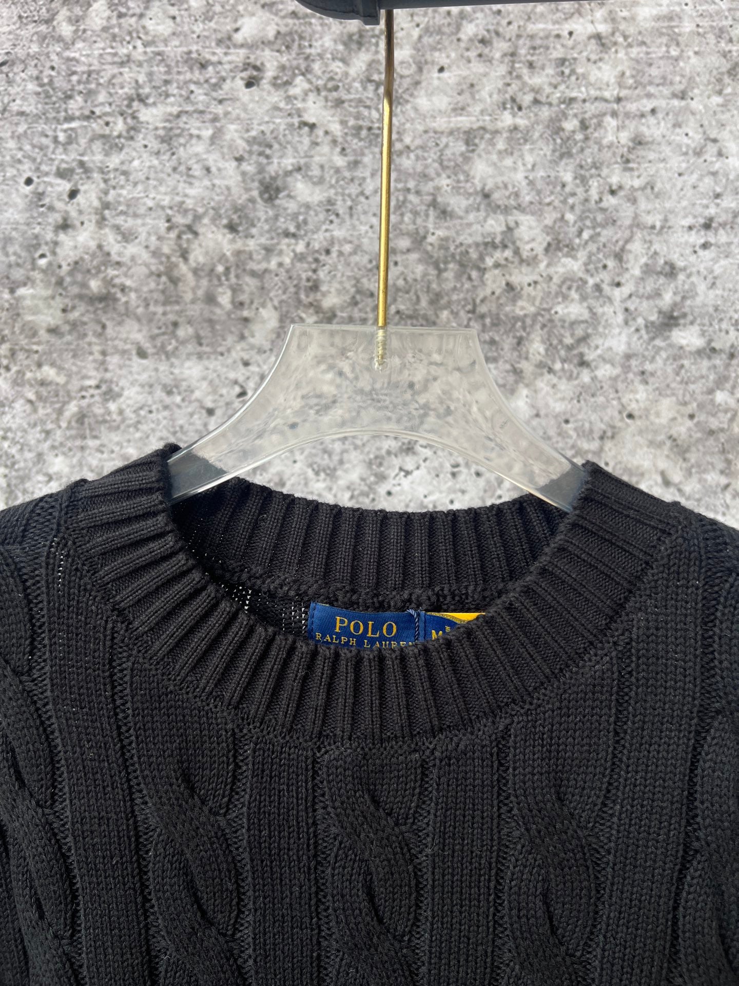 Ralph Lauren cable-knit sweater neckline with Polo label, ribbed crew collar