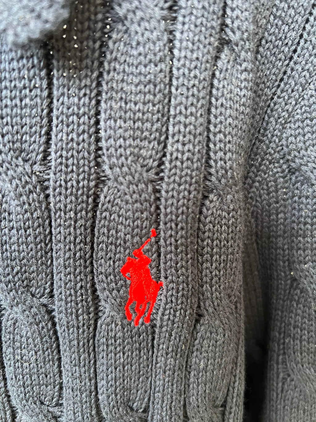 Red Polo pony logo on navy knit polo sweater