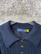 Navy ribbed polo sweater neckline with button placket and brand tag