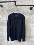 Navy cable-knit polo sweater with collared neckline and three button placket