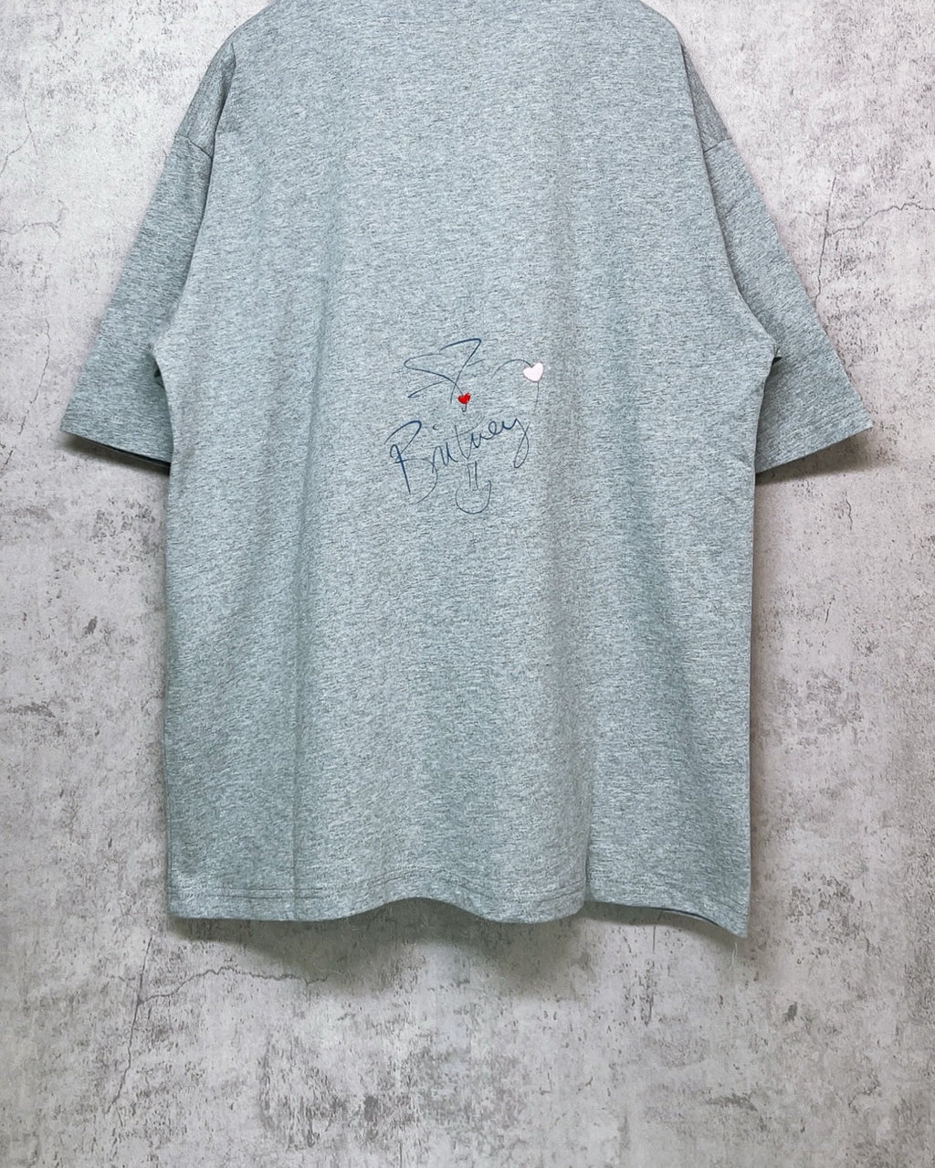 Balenciaga heather gray T-shirt back view with cursive signature-style print