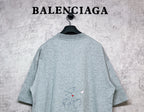 Balenciaga heather gray T-shirt back view with small signature-style graphic