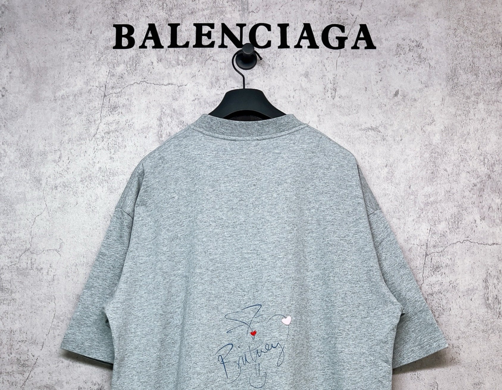 Balenciaga heather gray T-shirt back view with small signature-style graphic