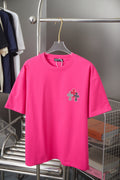 Pink short-sleeve T-shirt with small cross emblem at left chest