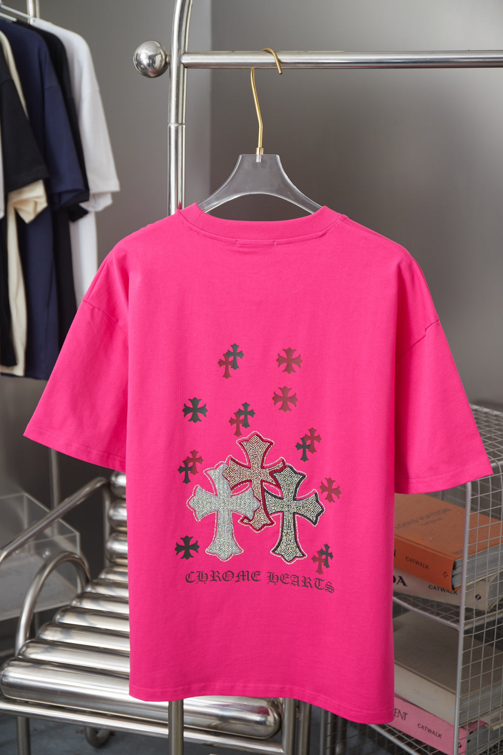 Pink short-sleeve T-shirt with large rhinestone cross print on back